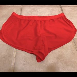 Red short (sheer!) trunks for gym show-off. 😏